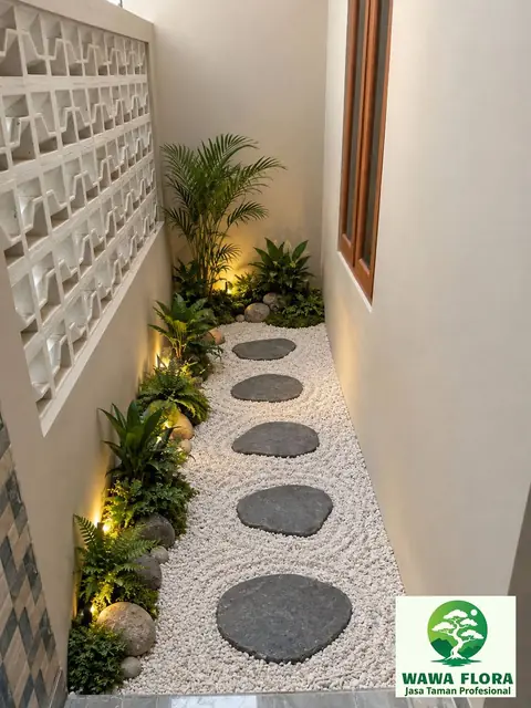 Lorong sempit dengan jalan batu bulat dan lampu dinding